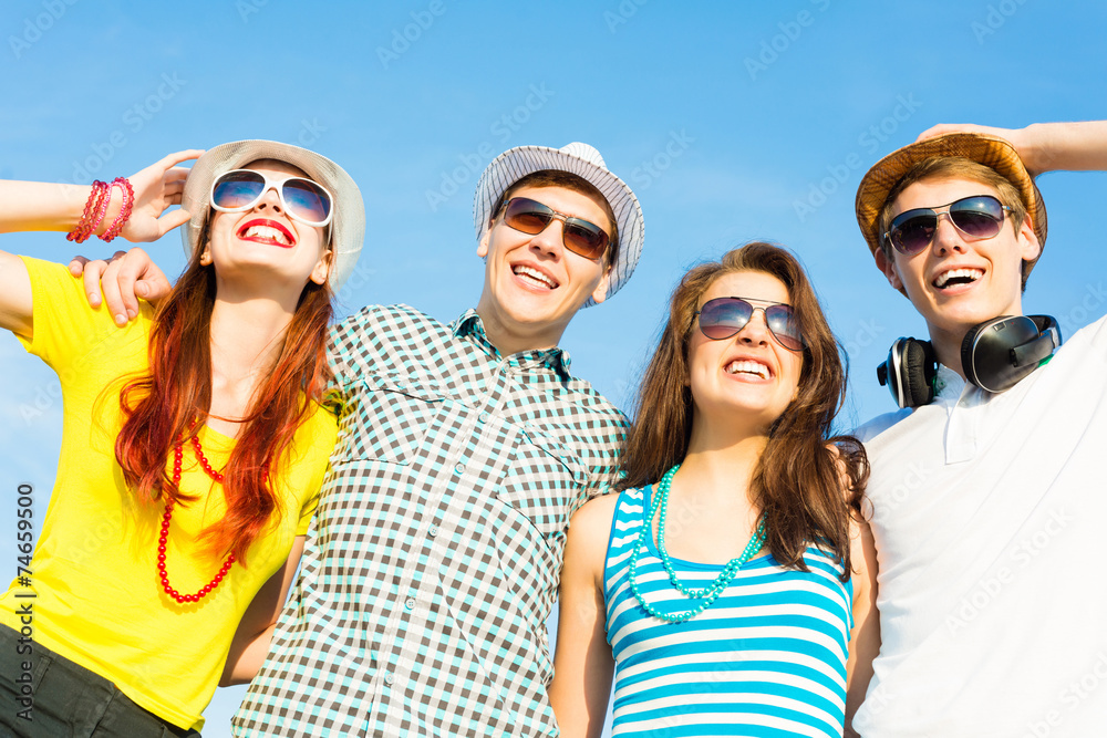 group of young people wearing sunglasses and hat group of young people wearing sunglasses and hat
