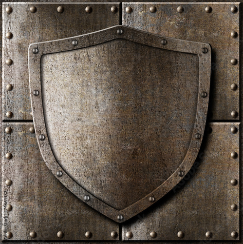 old metal shield over armor background