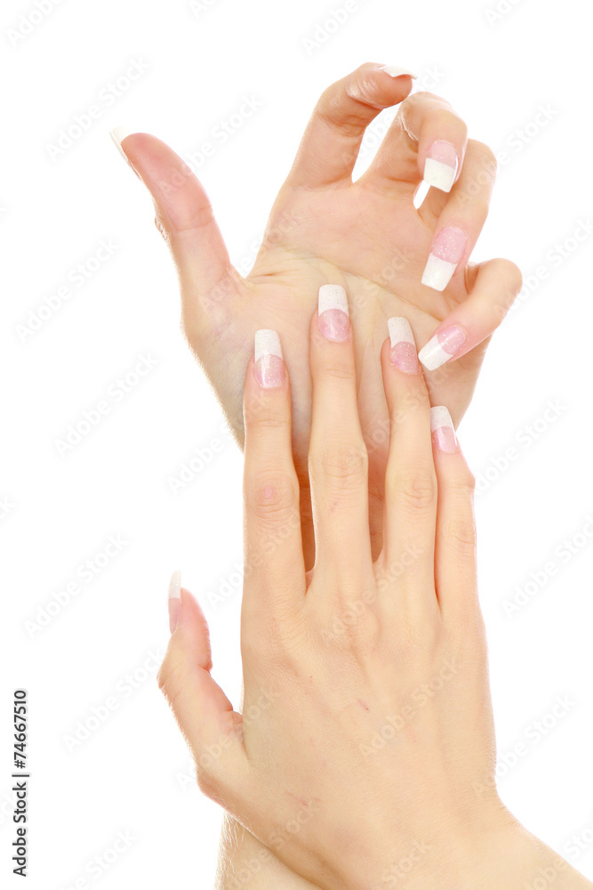Female hands with a nice manicure, isolated on white