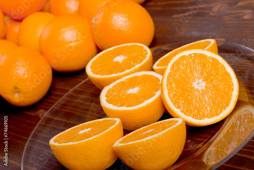 sliced ripe appetizing delicious orange on brown table