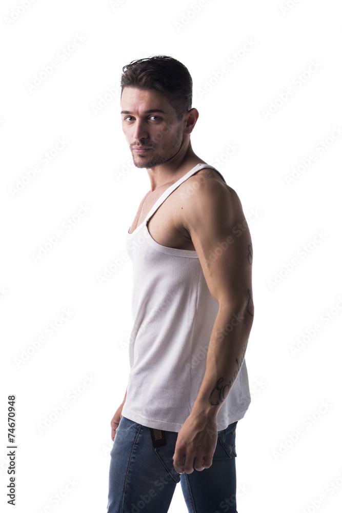Handsome athletic man with tank top and jeans Handsome athletic man with tank top and jeans