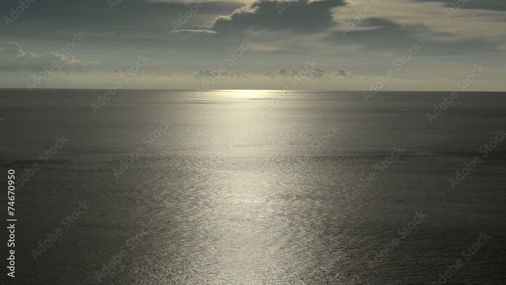 light beam shining through the cloudscape over the sea light beam shining through the cloudscape over the sea