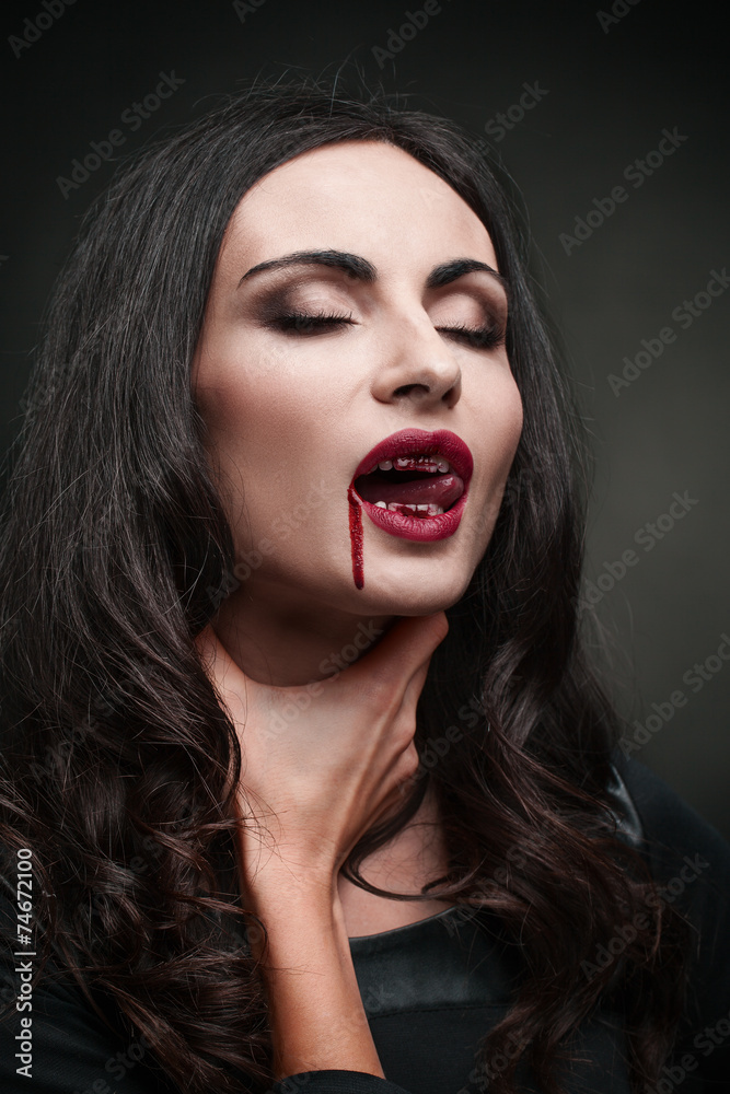 portrait of a beautiful model on a dark background in the studio portrait of a beautiful model on a dark background in the studio