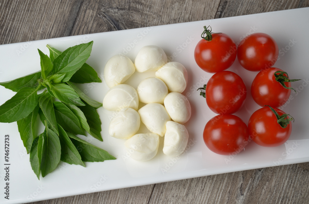 Caprese salad in shape of Italian flag Caprese salad in shape of Italian flag