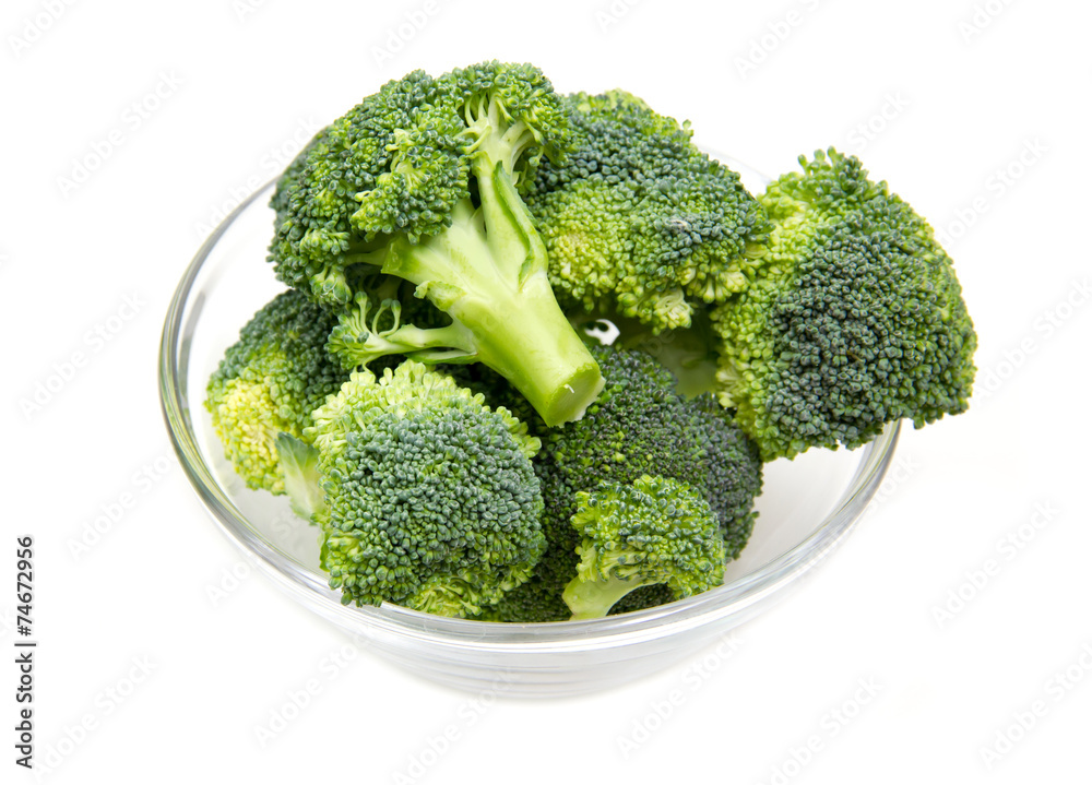 Broccoli in glass bowl on white background Broccoli in glass bowl on white background