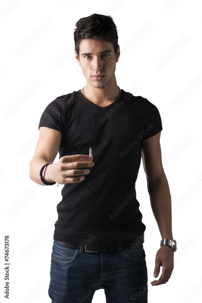 Handsome young man offering cigarette, giving it towards camera Handsome young man offering cigarette, giving it towards camera