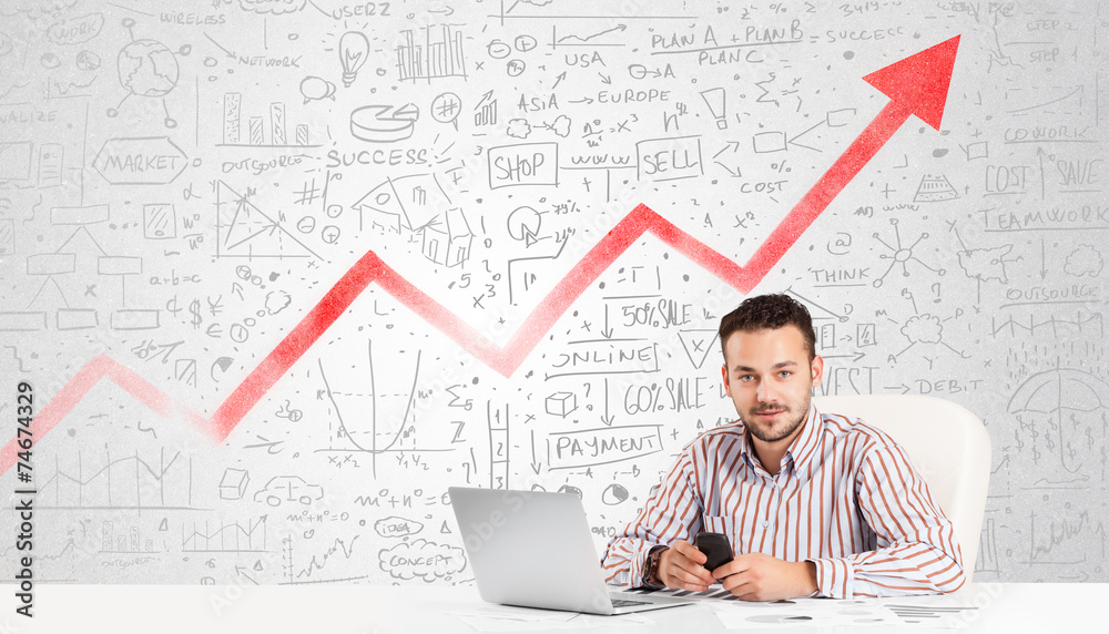 Business man sitting at table with market diagrams Business man sitting at table with market diagrams