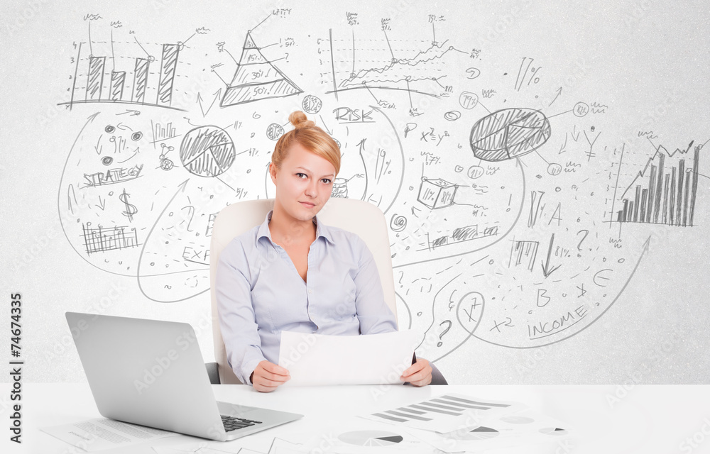 Business woman at desk with hand drawn charts Business woman at desk with hand drawn charts