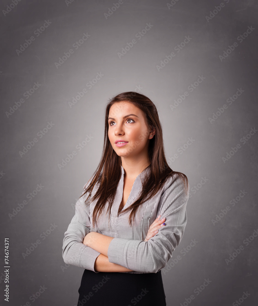 Young woman standing and thinking with copy space Young woman standing and thinking with copy space