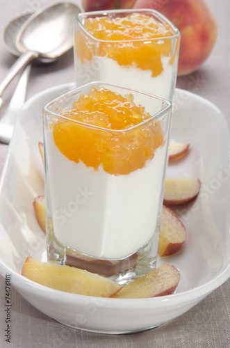peach compote with yogurt in a shot glass