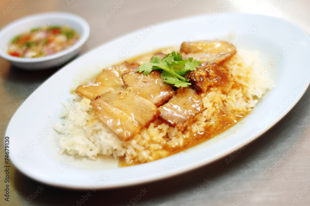 close up chinese steamed pork and rice in plastic dish