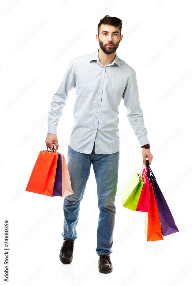 Handsome man holding shopping bags