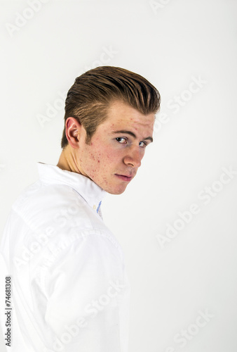 smart looking teenage boy in white shirt © travelview