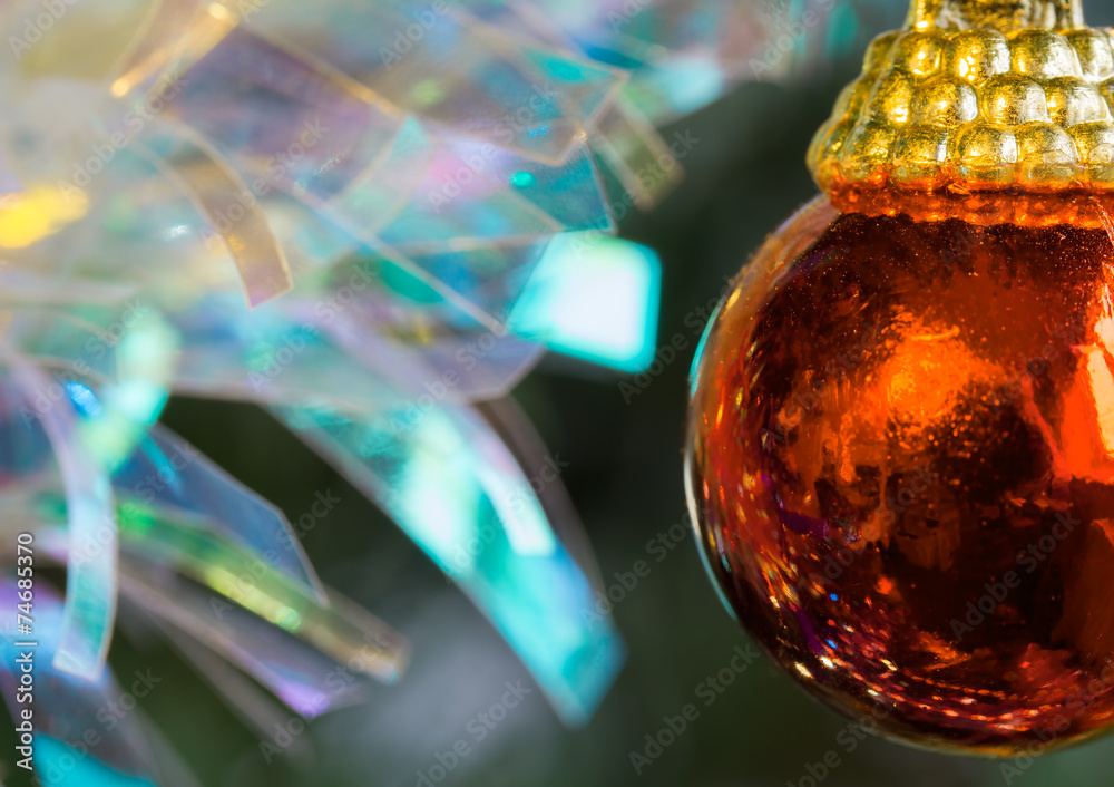 Fototapeta premium Christmas red bauble with tinsel