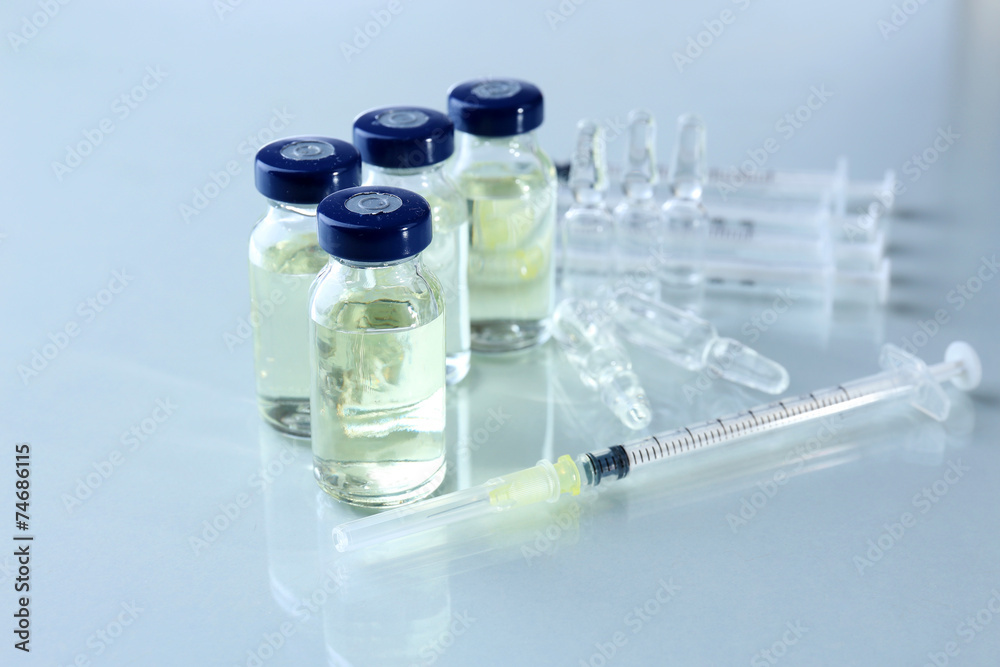 Vaccine in vial with syringe Vaccine in vial with syringe