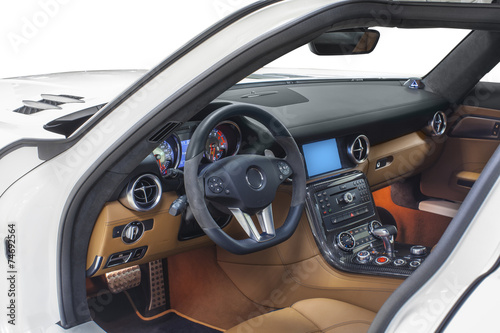 Interior of car. Orange cockpit with carbon decoration © dmindphoto