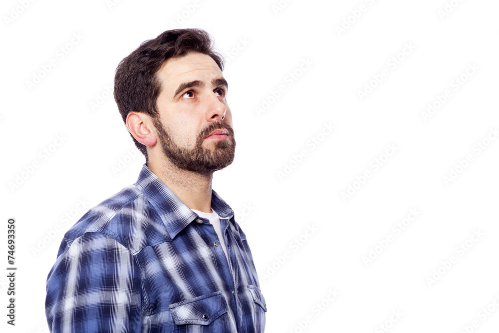 Pensive casual man looking up, isolated over white background Pensive casual man looking up, isolated over white background