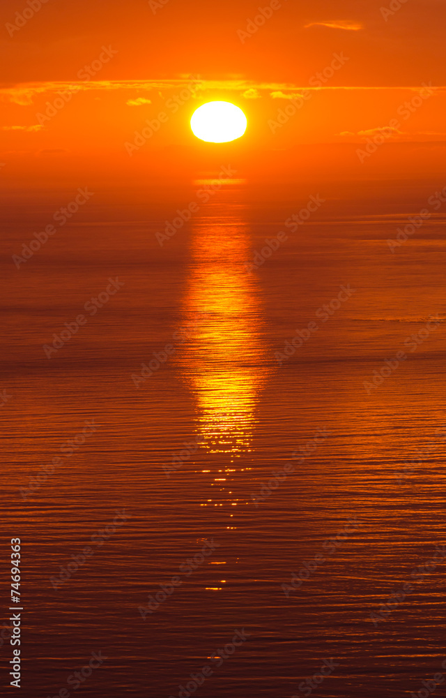 Sun setting in the ocean