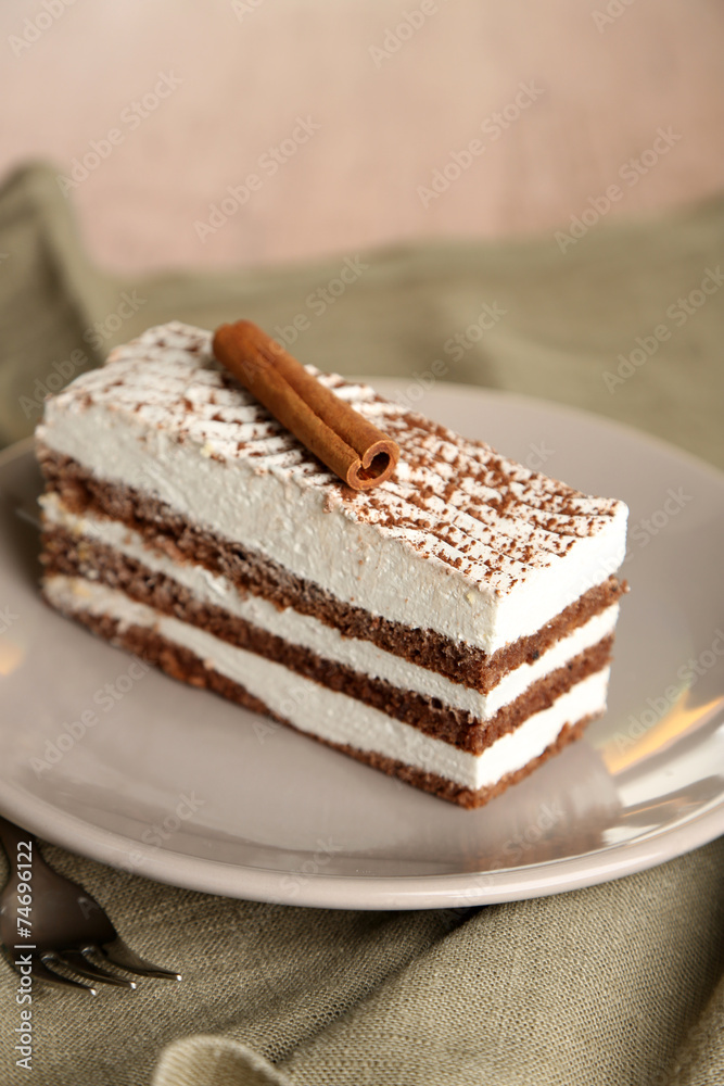 Tasty tiramisu cake on plate, close up Tasty tiramisu cake on plate, close up