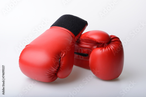 Pair of red leather boxing gloves isolated on white