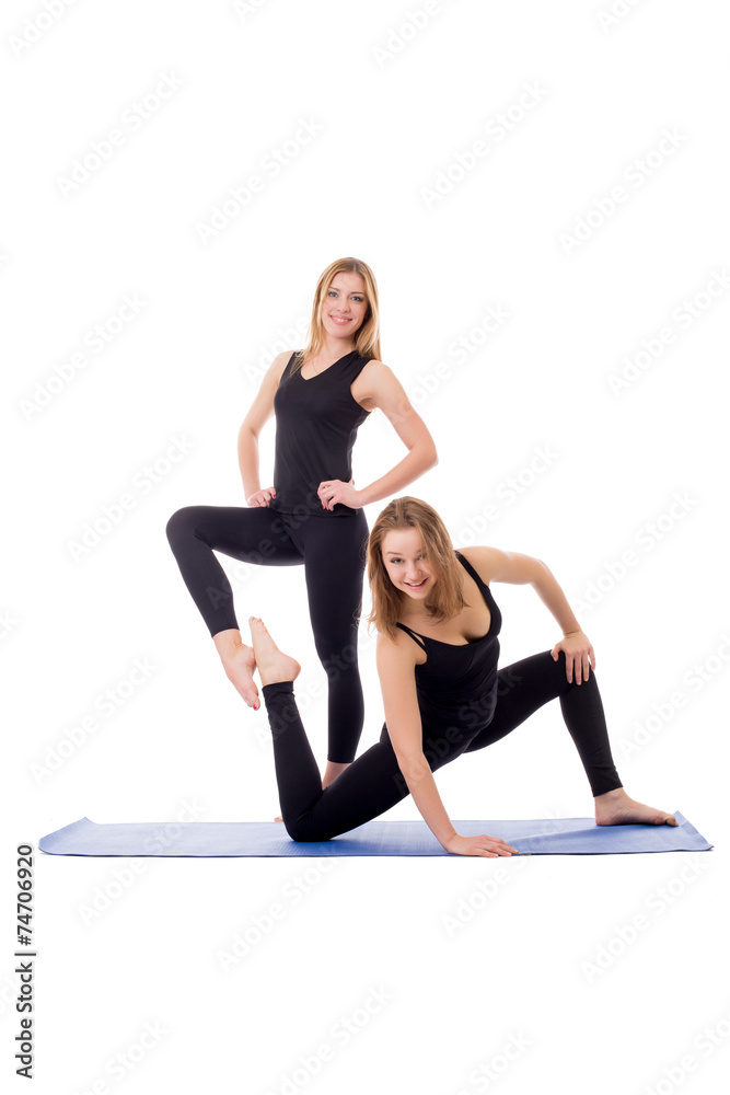 Merry sporty girlfriends posing at camera Merry sporty girlfriends posing at camera