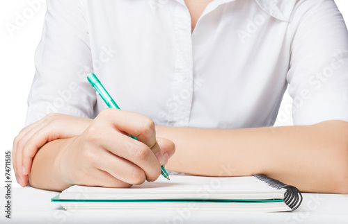 Close up Business woman writing on notebook with pen.