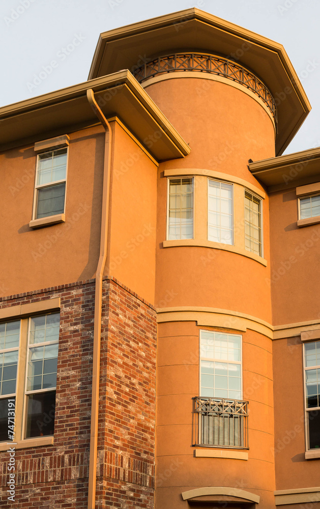 Fototapeta premium Round Corner Condo Building in Dusk Light