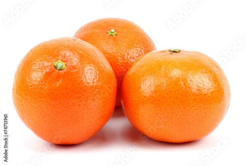 Three ripe tangerines  Isolated on white