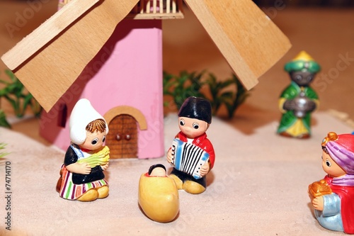 Nativity scene with Holy Family in Dutch style and a windmill photo