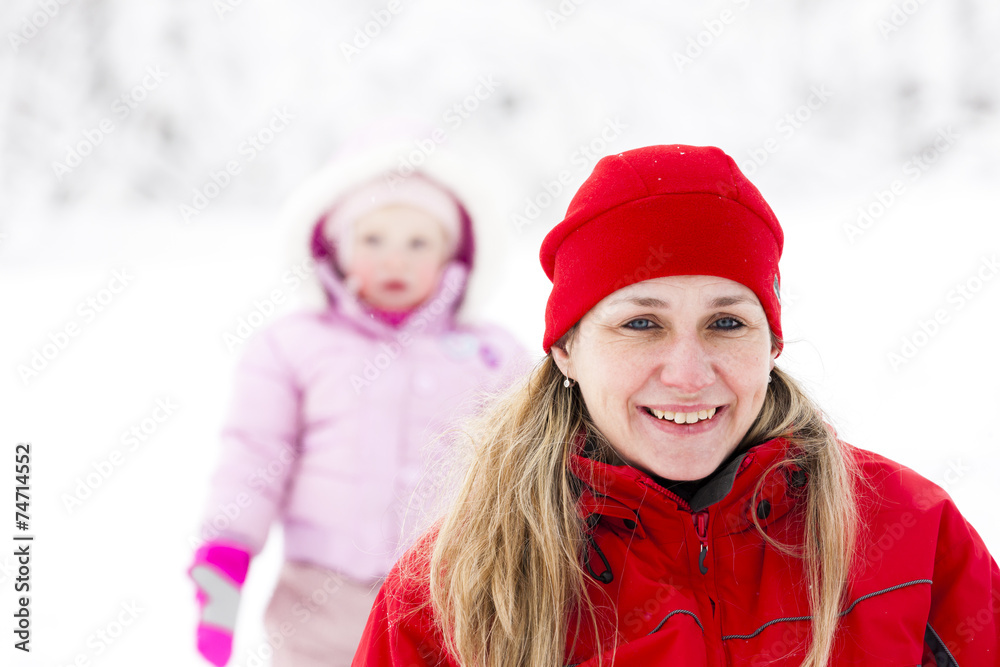 portrait of mother with little daughter in winter portrait of mother with little daughter in winter