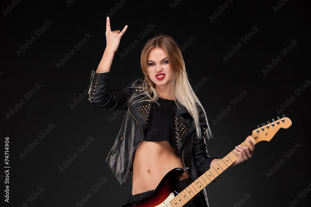 Fototapeta premium Beautiful girl playing guitar
