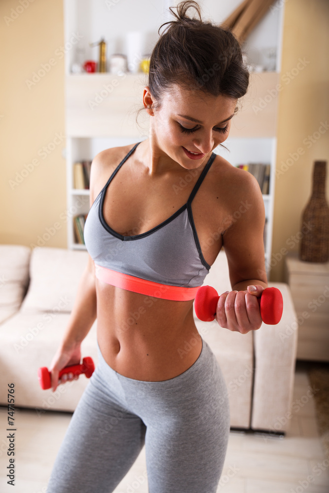 Attractive female exercise at home.Fitness.