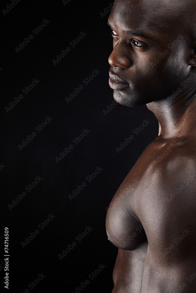 Man standing shirtless in the studio Man standing shirtless in the studio