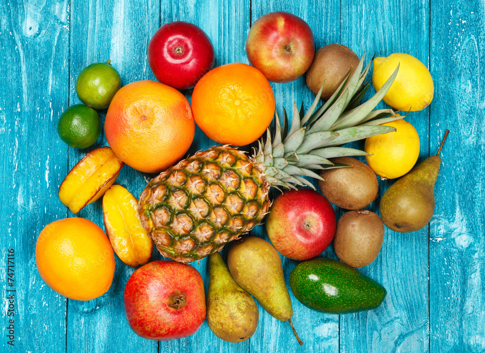 Set of colorful fruits on old wood background Set of colorful fruits on old wood background