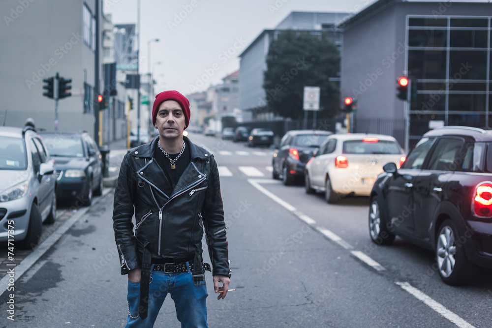 Punk guy posing in the city streets