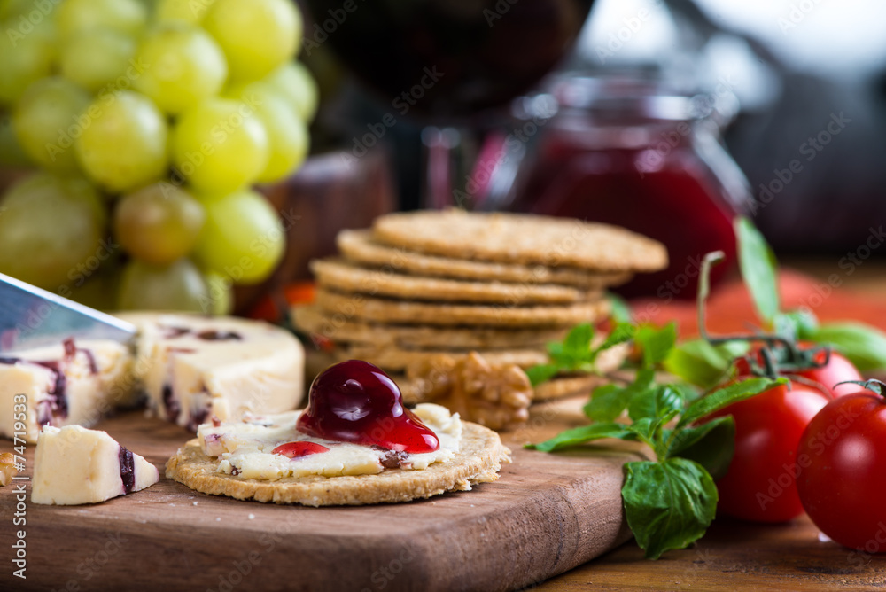 close view on oatcake with stilton cheese and cranberry close view on oatcake with stilton cheese and cranberry