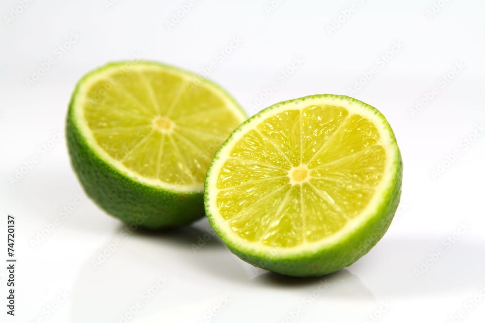 Fresh limes on white background