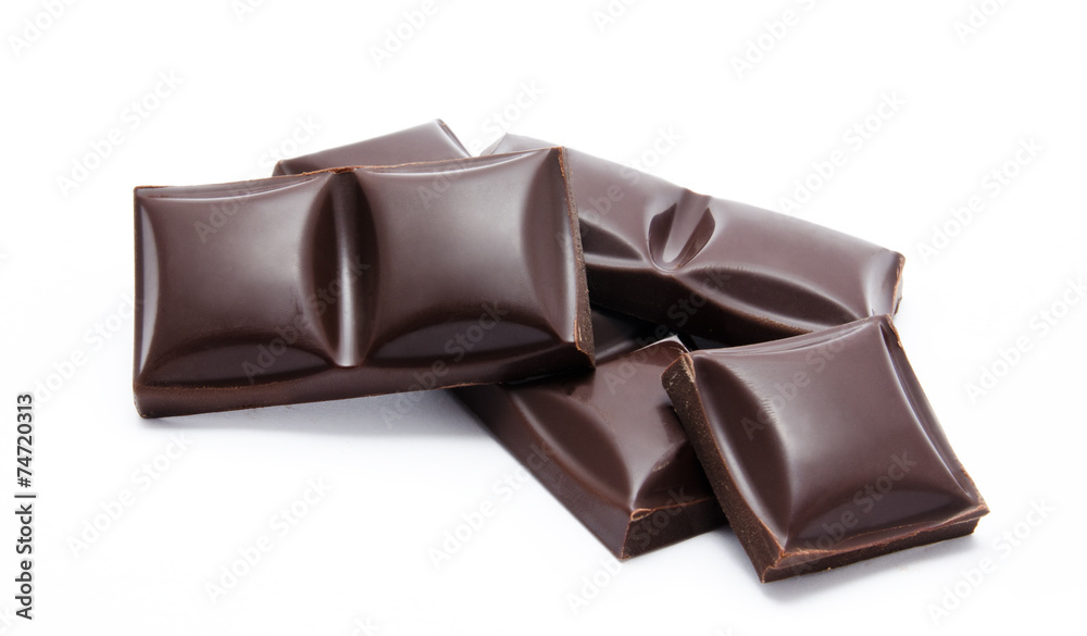 Dark chocolate bars stack with crumbs isolated Dark chocolate bars stack with crumbs isolated