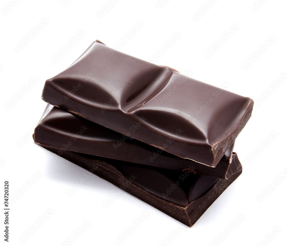 Dark chocolate bars stack with crumbs isolated Dark chocolate bars stack with crumbs isolated