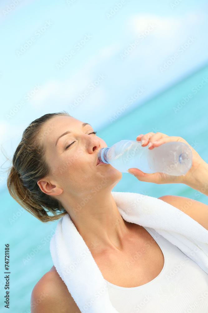 Portrait of fitness woman drinking water after working out Portrait of fitness woman drinking water after working out