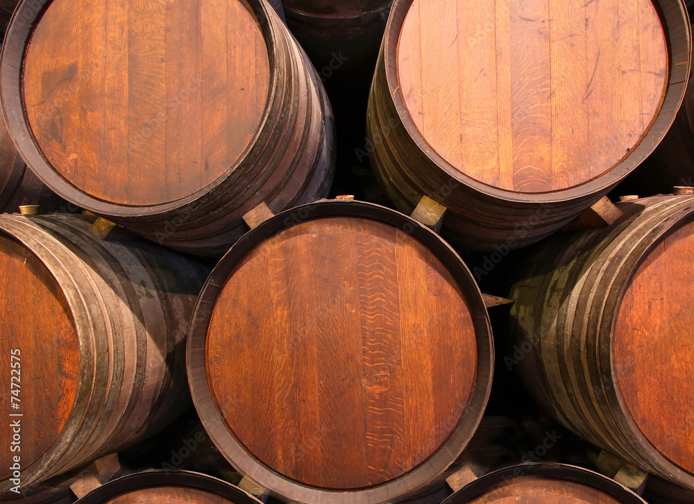 Row of wooden barrels of tawny portwine, Porto, Portugal