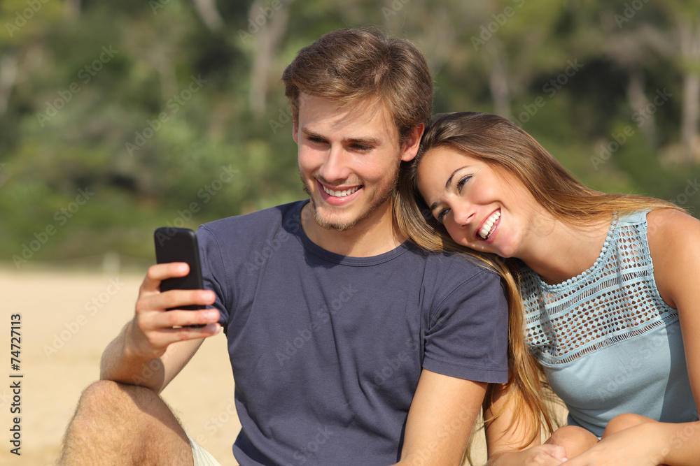 Teenager couple sharing social media on the smart phone Teenager couple sharing social media on the smart phone