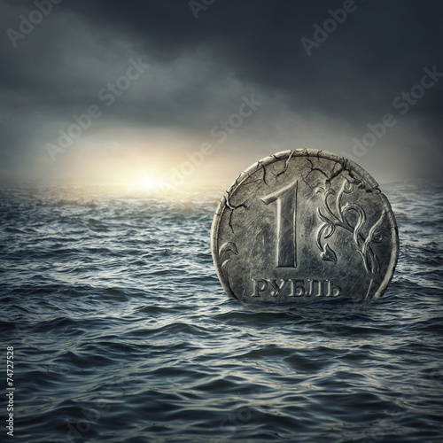 Ruble coin sinking in water photo