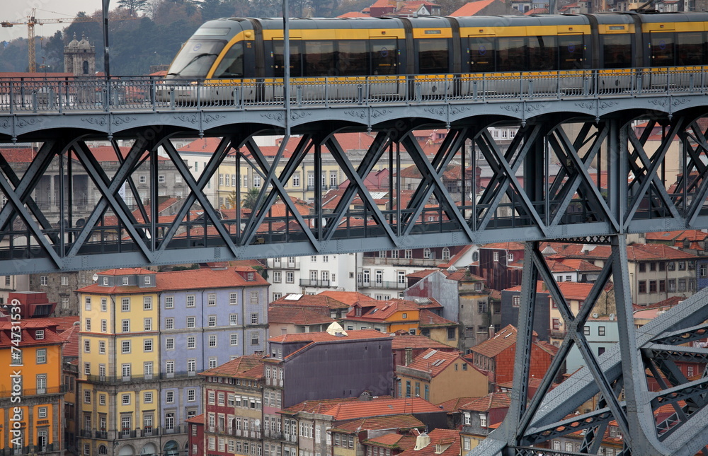 View of  Porto with Dom Luis bridge and  metro train 