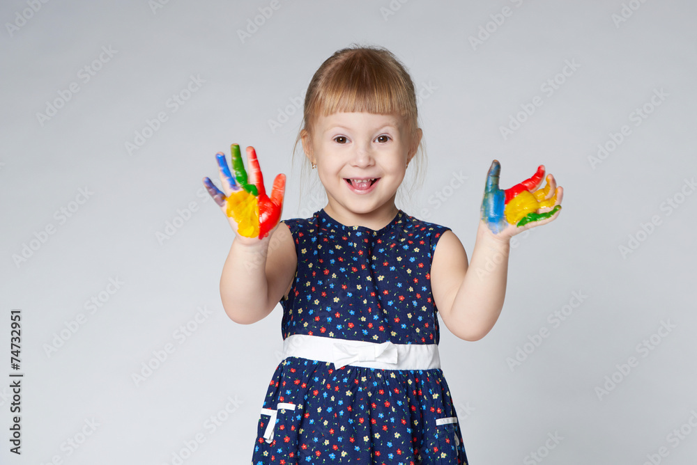 little girl with hands in paint on white little girl with hands in paint on white