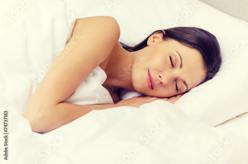 beautiful woman sleeping in bed