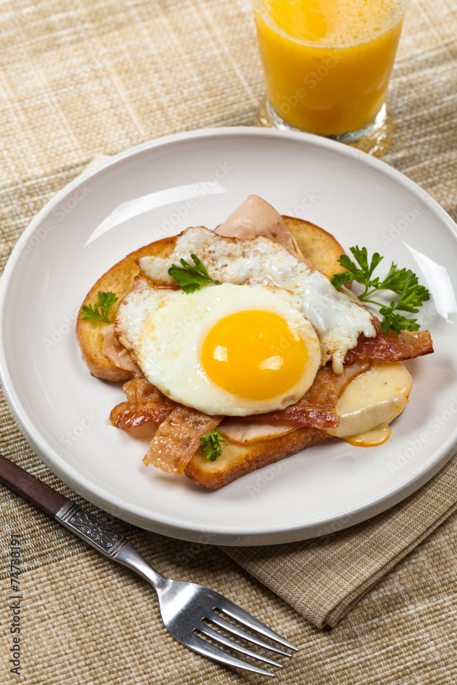 Sandwich with fried eggs - Croque Madame. Selective focus. Sandwich with fried eggs - Croque Madame. Selective focus.