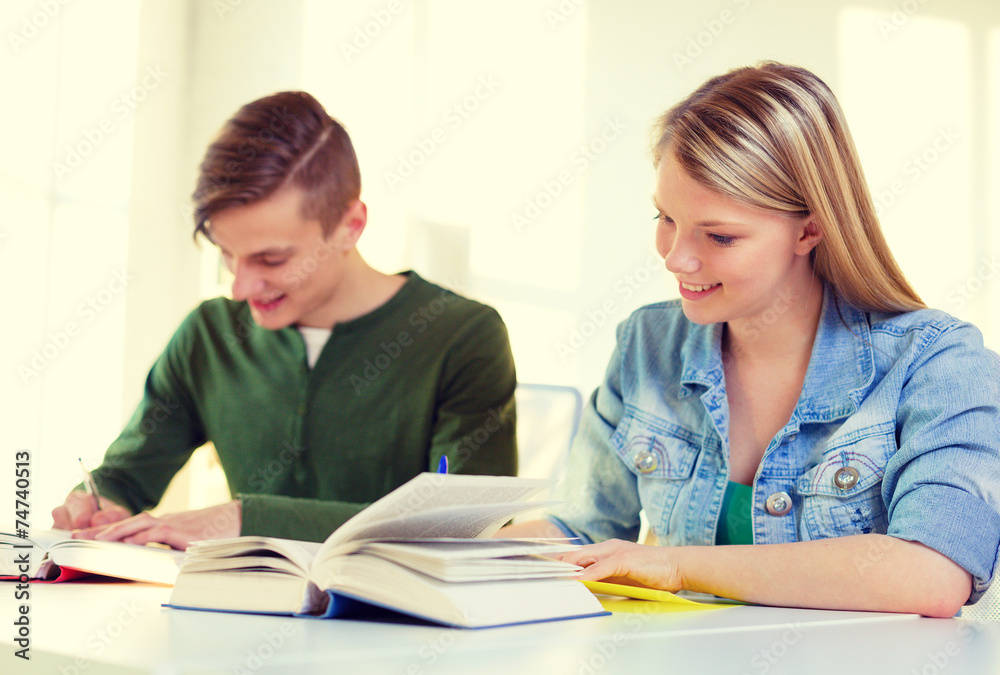 students with textbooks and books at school students with textbooks and books at school