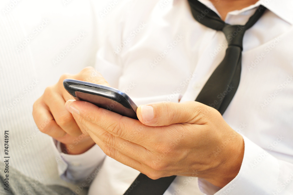 young man using a smartphone young man using a smartphone