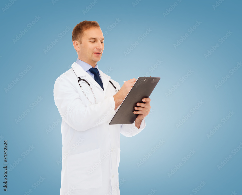 smiling male doctor with clipboard and stethoscope smiling male doctor with clipboard and stethoscope